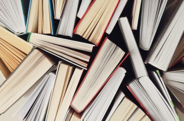 Many books textured background, top view. Multicolored books